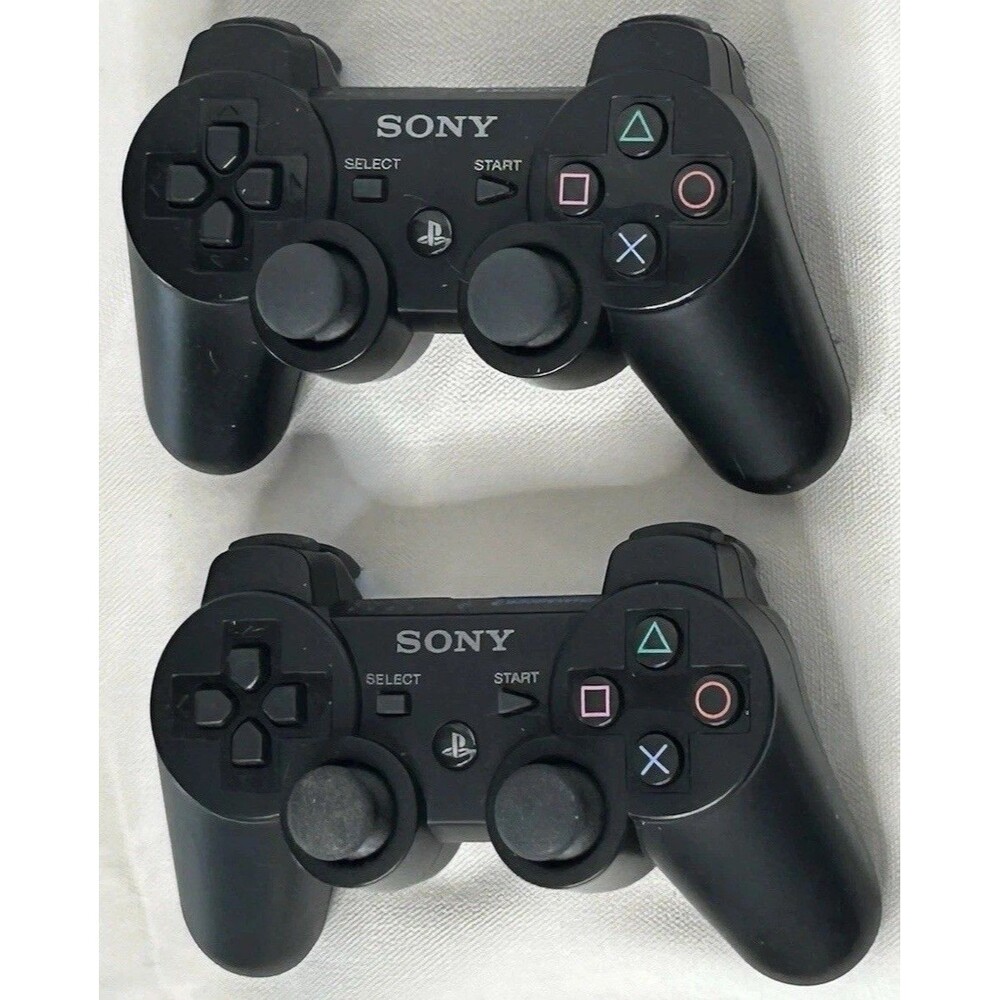 Two Sony PlayStation 3 (PS3) Original OEM DualShock 3 Controllers + 2 Cords
